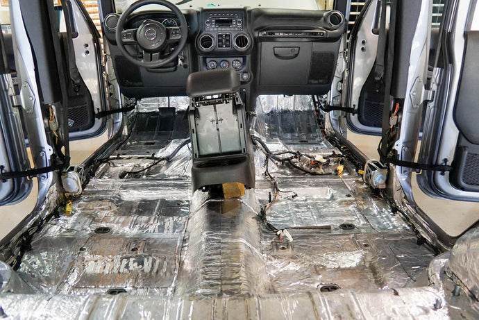 Hushmat Custom Vehicle Sound Deadening and Thermal Insulation Cargo Kit treats the floor and rear quarter panels.